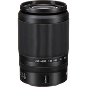 Black camera lens with Nikkor branding on a white background