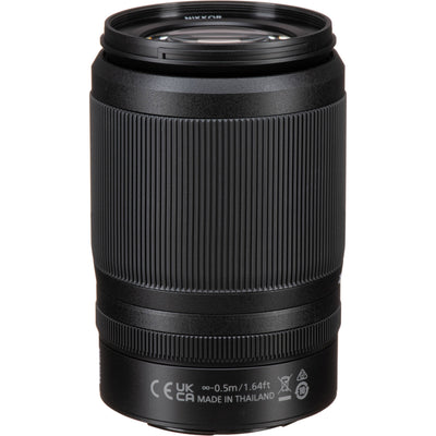 Black camera lens on a white background