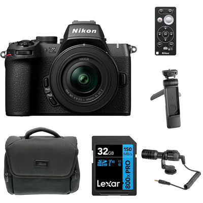 Nikon Z50 II Creator Kit in black featuring the Nikon Z50 II mirrorless camera body, mounted 16–50 mm and 50–250 mm zoom lenses, a 35 mm prime lens, and included accessories such as a vertical grip, LED light, and external microphone—all displayed together.