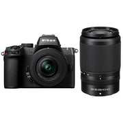 Nikon Z50 II mirrorless camera kit in black featuring two NIKKOR Z lenses (16–50 mm and 50–250 mm), with 3.2″ tilting touchscreen, built-in electronic viewfinder, and ergonomic textured grip.