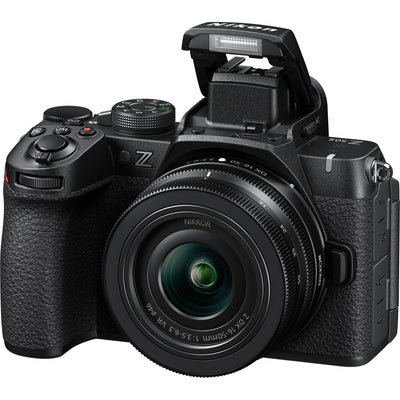 Nikon Z50 II mirrorless camera kit in black featuring two NIKKOR Z lenses (16–50 mm and 50–250 mm), with 3.2″ tilting touchscreen, built-in electronic viewfinder, and ergonomic textured grip.