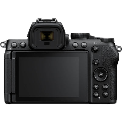 Nikon Z50 II Vlogging Kit in black featuring the Z50 II mirrorless camera body with attached NIKKOR Z 16–50 mm lens, alongside accessories including a compact vlogging LED light, shotgun microphone on cold shoe, handheld grip with wrist strap, and USB-C cable for charging.