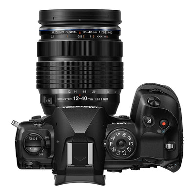OM System OM-1 Mark II mirrorless camera with 20MP stacked BSI Live MOS sensor, TruePic X processor, paired with versatile 12-40mm Pro II lens, 5-axis IBIS with 8.5 EV, 4K 60p video, and advanced AI autofocus.