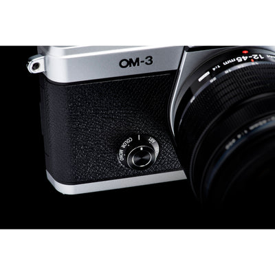 OM System OM-3 mirrorless camera with 20MP stacked BSI Live MOS sensor, TruePic X processor, 1053-point Quad Pixel AF covering 100% frame, up to 50 fps continuous AF burst, 4K 60p video, IP53 weather sealing, and 3-inch vari-angle touchscreen.