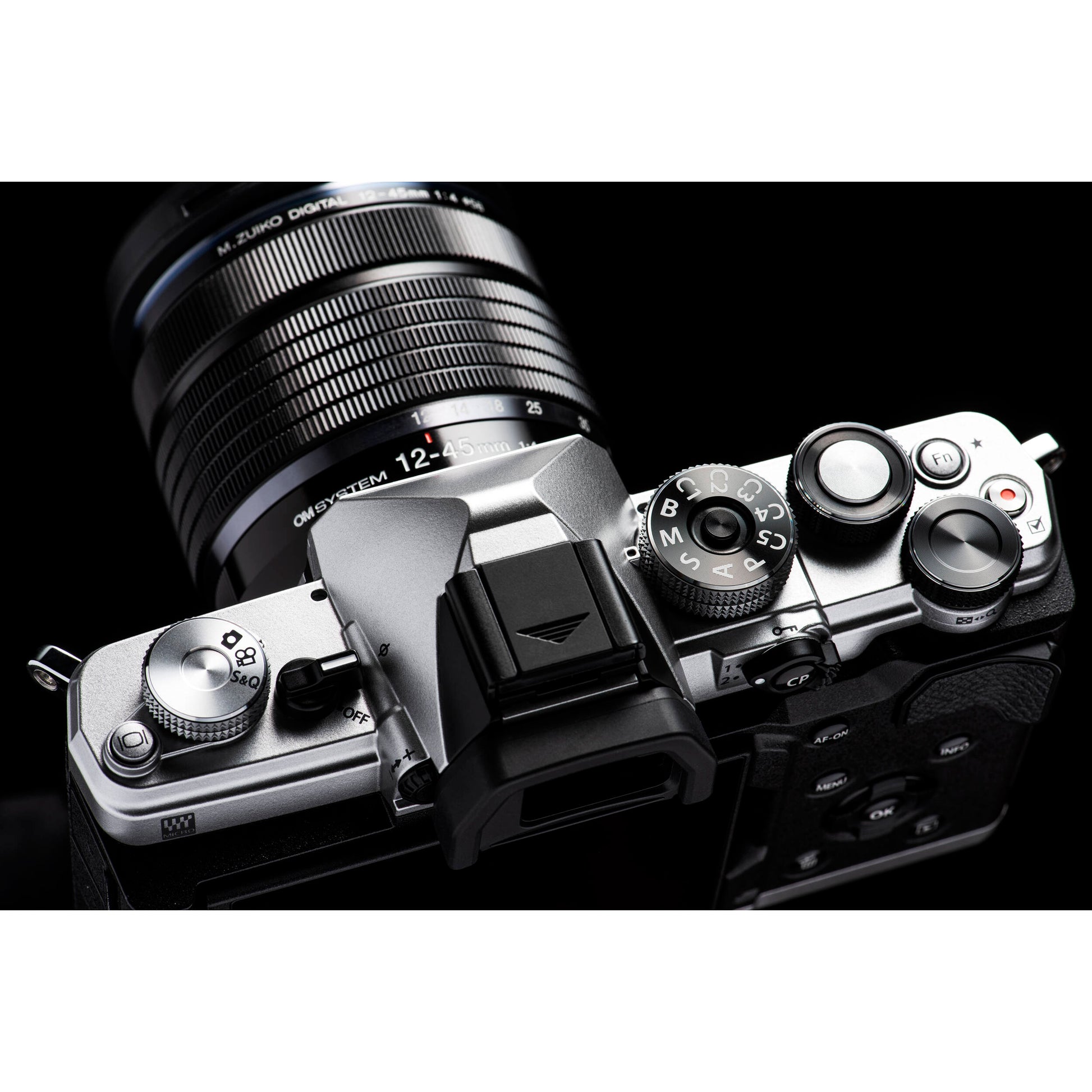OM System OM-3 mirrorless camera with 20MP stacked BSI Live MOS sensor, TruePic X processor, 1053-point Quad Pixel AF covering 100% frame, up to 50 fps continuous AF burst, 4K 60p video, IP53 weather sealing, and 3-inch vari-angle touchscreen.