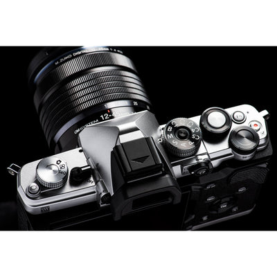 OM System OM-3 mirrorless camera with 20MP stacked BSI Live MOS sensor, TruePic X processor, 1053-point Quad Pixel AF covering 100% frame, up to 50 fps continuous AF burst, 4K 60p video, IP53 weather sealing, and 3-inch vari-angle touchscreen.