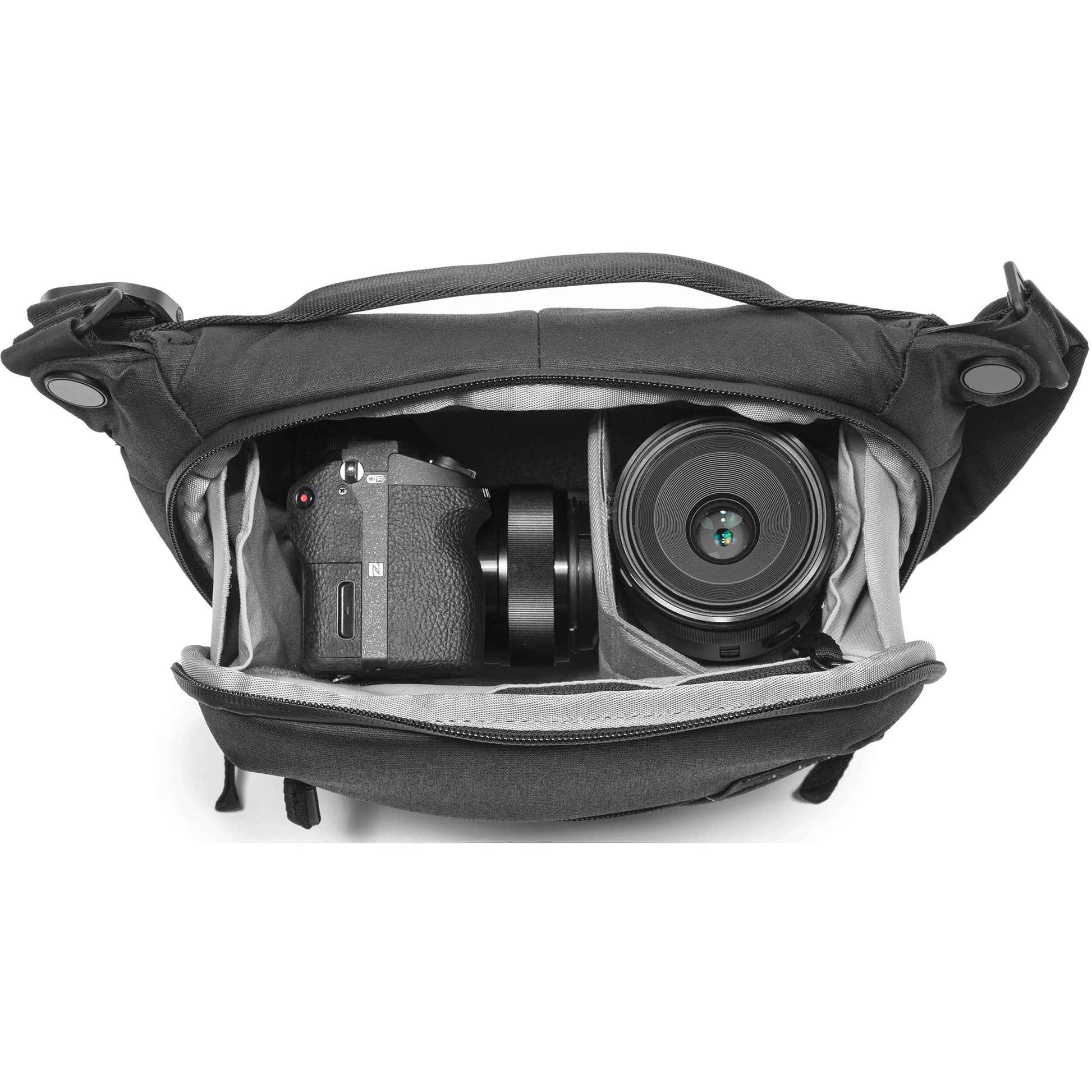 Everyday Sling V2.0 3L ash bag worn as waist or shoulder sling with zippered compartments.