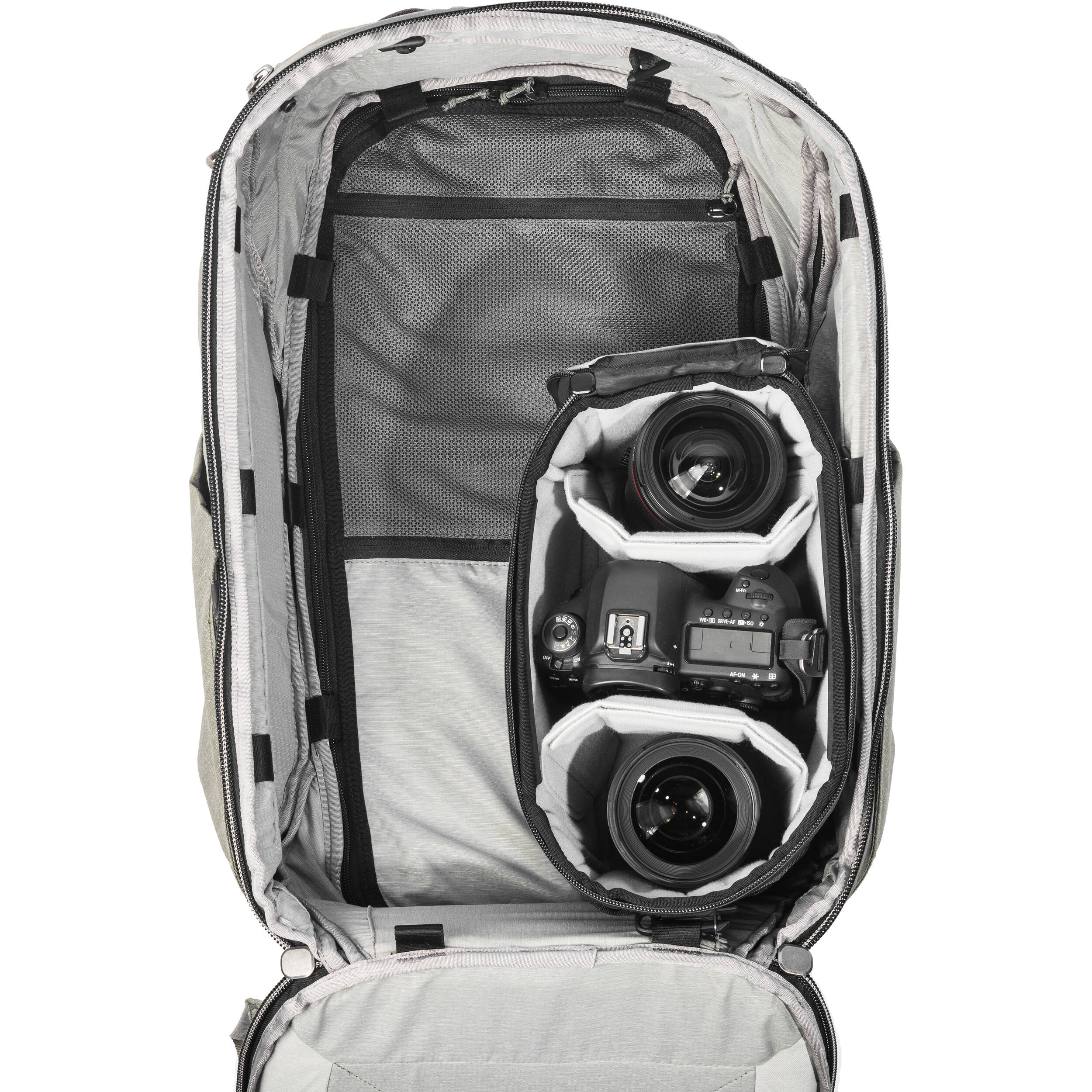 Black handheld Peak Design Camera Cube V2 with adjustable dividers, zipper closure, and durable nylon exterior, perfect for carrying camera gear safely.
