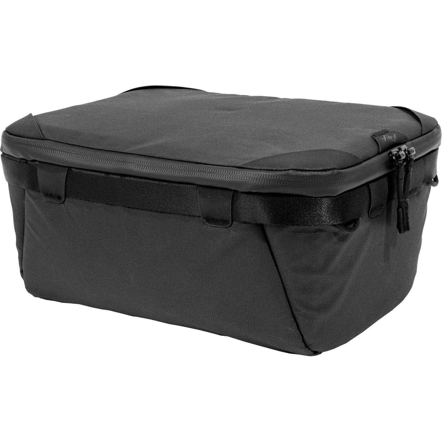 Black handheld Peak Design Camera Cube V2 with adjustable dividers, zipper closure, and durable nylon exterior, perfect for carrying camera gear safely.
