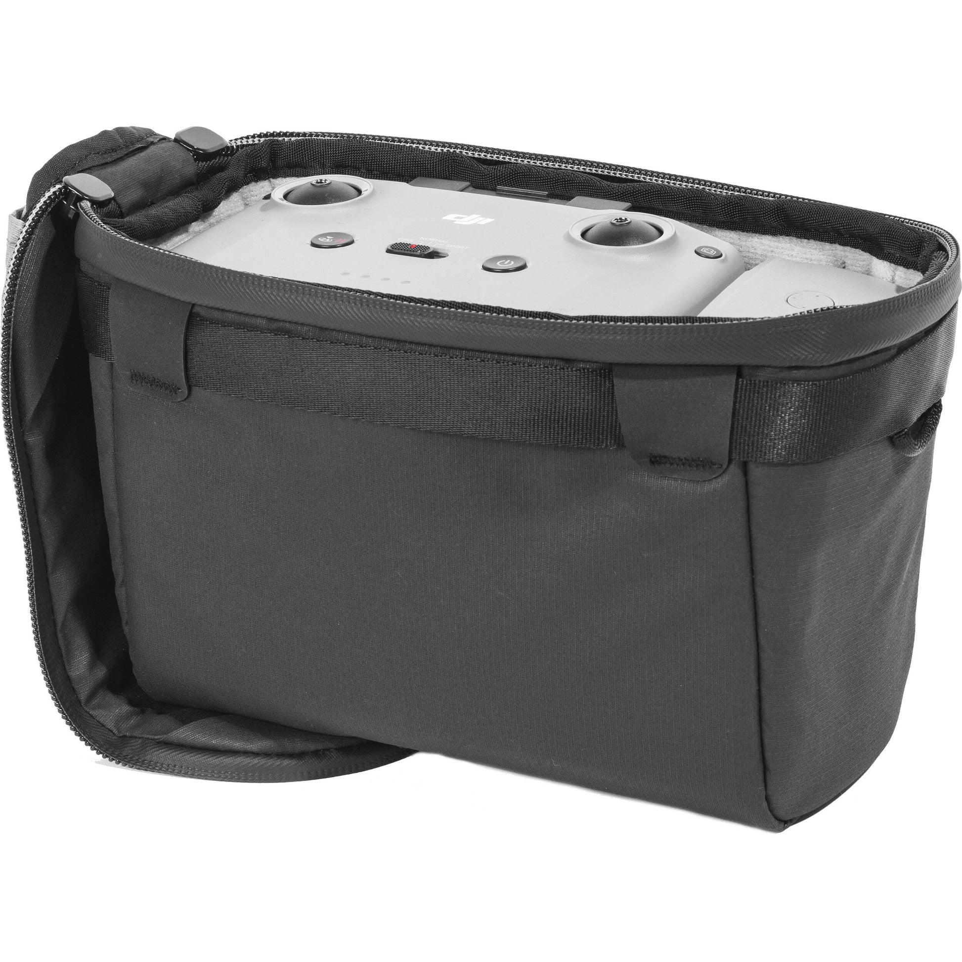 Black handheld Peak Design Camera Cube V2 with adjustable dividers, zipper closure, and durable nylon exterior, perfect for carrying camera gear safely.
