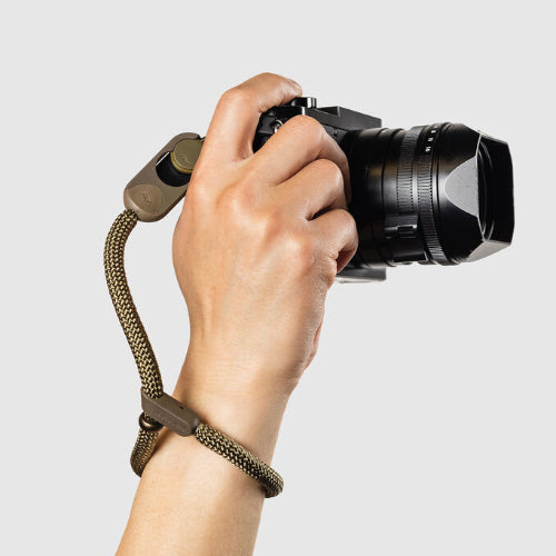 Peak Design Cuff Rope wrist strap in Kelp colour with Anchor Links securing a camera