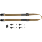 Peak Design Leash camera strap in Coyote color, adjustable length 83-145 cm, ultralight nylon webbing with leather accents, quick-release anchors rated for 90kg, versatile for sling, neck, shoulder, or cross-body use.