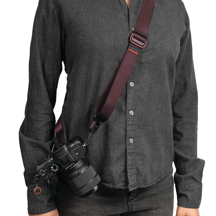 Versatile camera strap in Eclipse Purple with quick-release anchors, adjustable 99–145 cm length and 90.7 kg capacity for secure, comfortable carry.