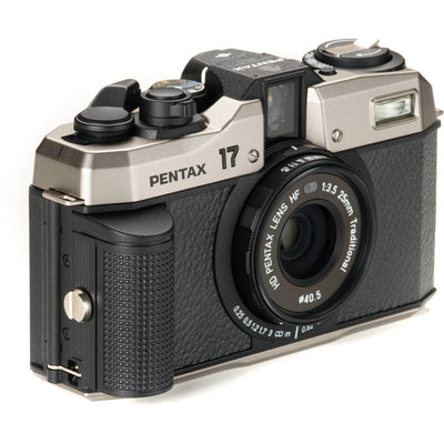 Pentax camera with a black and silver design on a white background