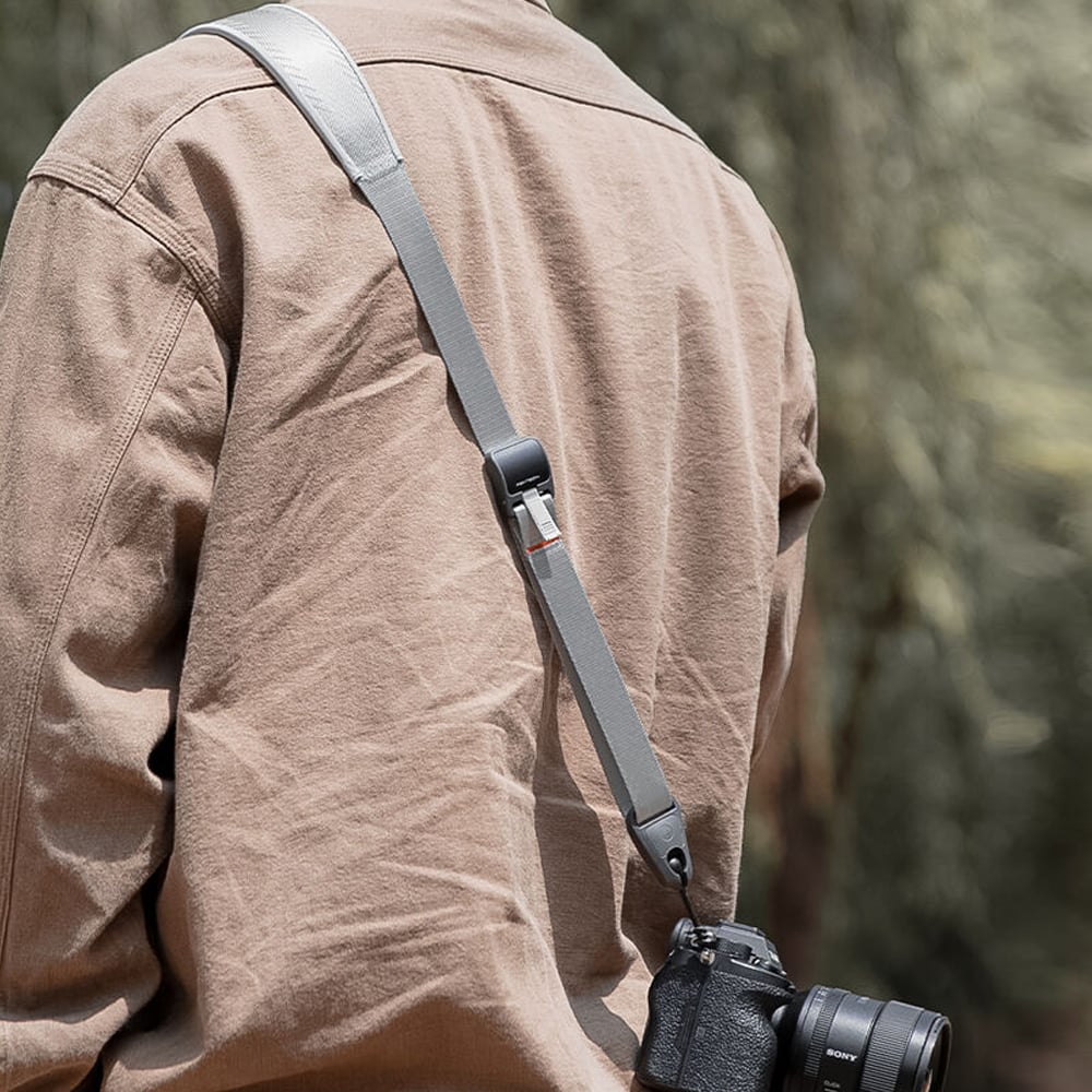PGYTECH Camera Strap in Fern Green with quick-release clips and adjustable padded shoulder support, designed for DSLR and mirrorless cameras.