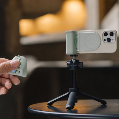 PGYTECH MagCam Phone Grip in grey with modular design including wireless charging, Bluetooth remote, ergonomic camera grip, and 3000mAh power bank.