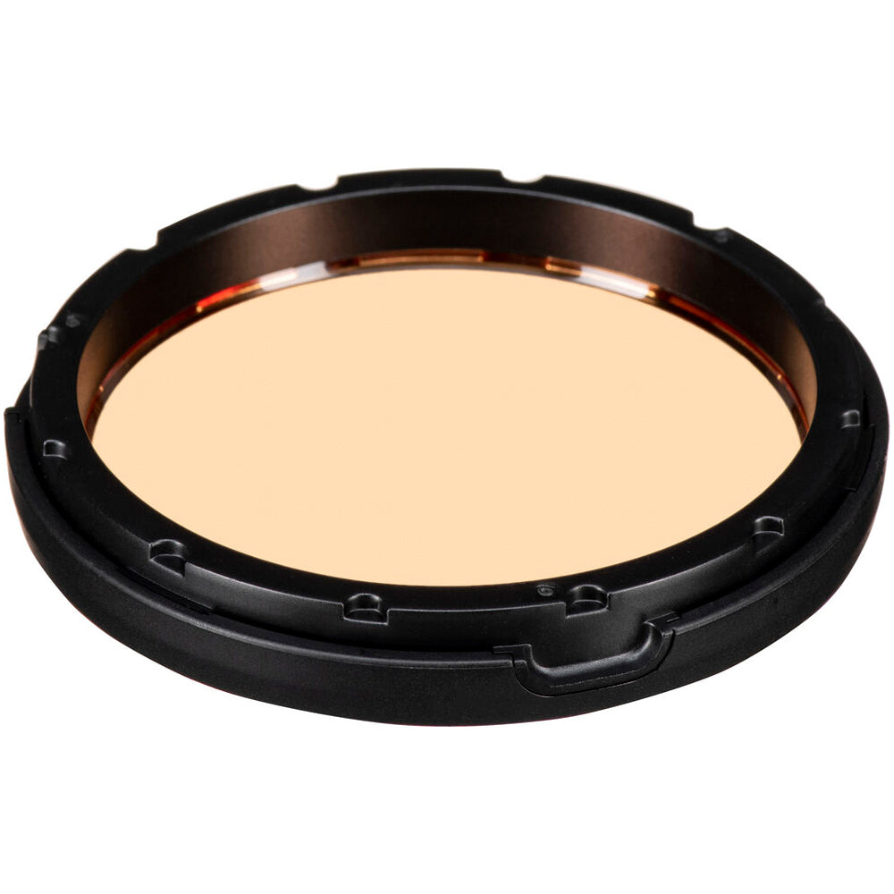 Round makeup compact with beige powder on a white background