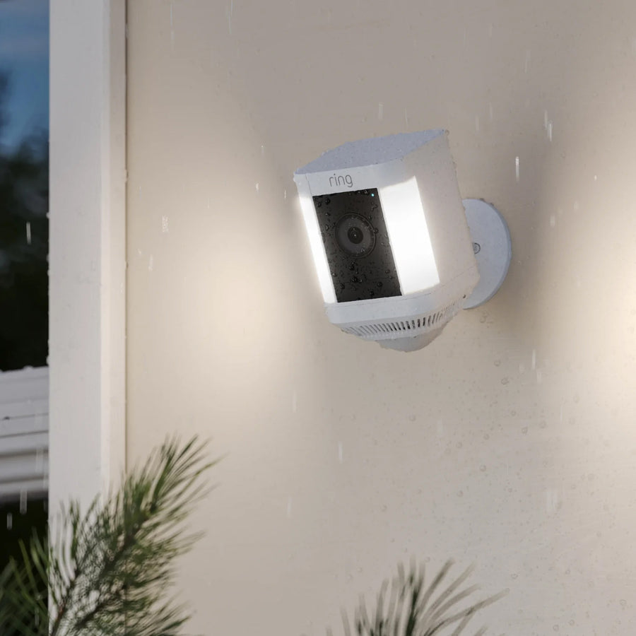 Ring Spotlight Cam Plus Battery Outdoor Security Camera with Spotlights in White lifestyle image