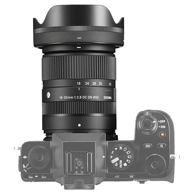 Camera lens with Sigma branding on a white background