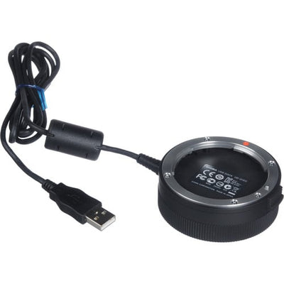 Black camera lens adapter with USB cable on a white background