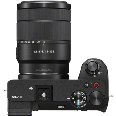 Black camera with lens and control buttons on a white background