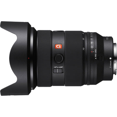 Camera lens with 'G' logo on a white background