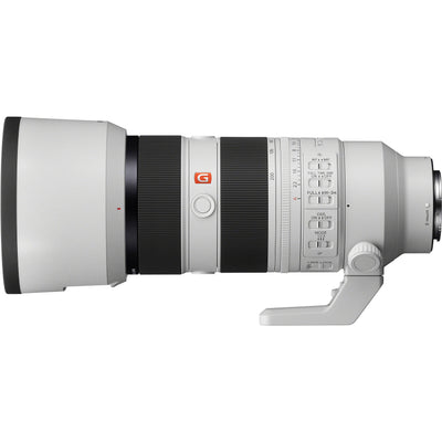 Camera lens with Sony GM logo and hood on a white background