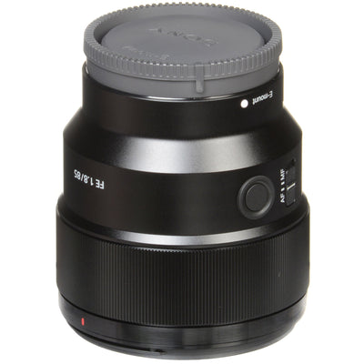 Camera lens with gray cap on a white background