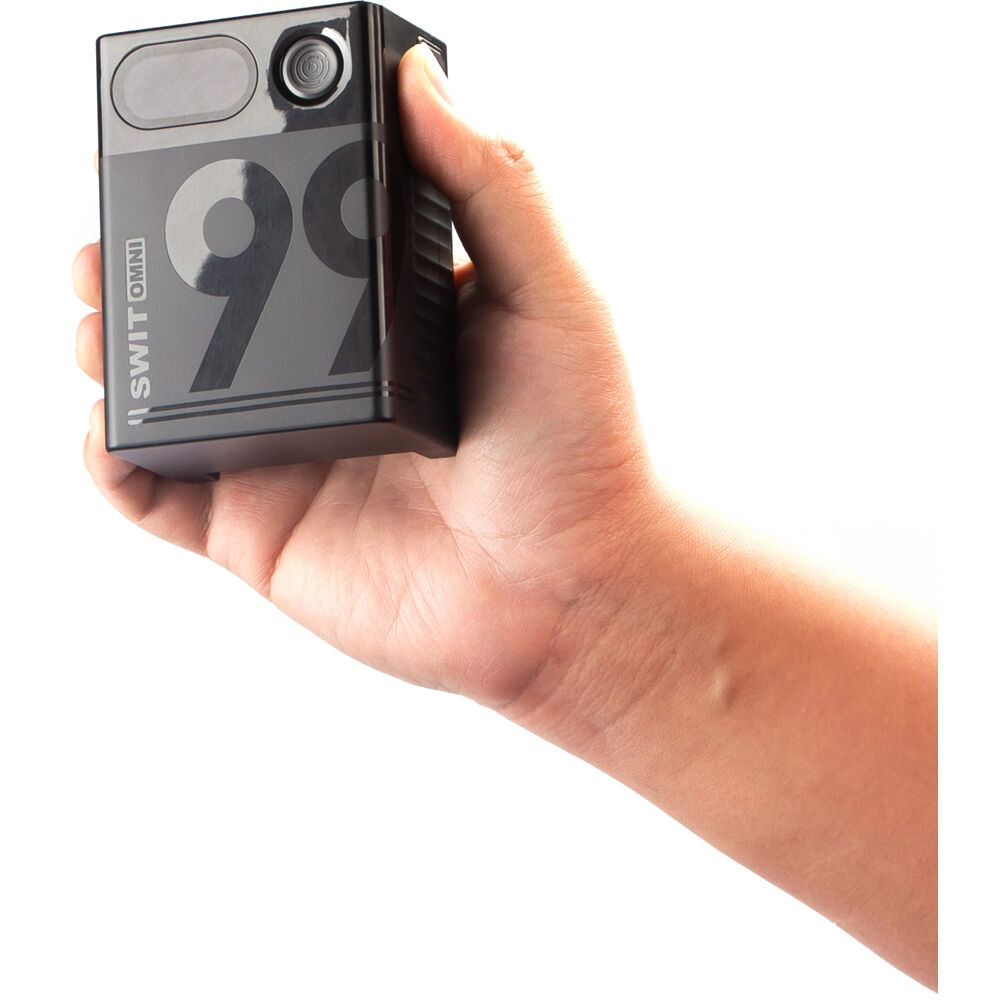 Portable SWIT OMNI-99S 99Wh V-Mount battery for cameras and accessories with USB-C charging.
