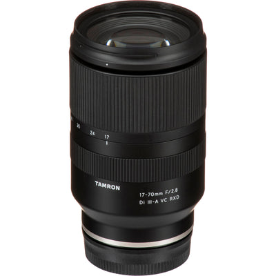 Black camera lens with Tamron branding on a white background