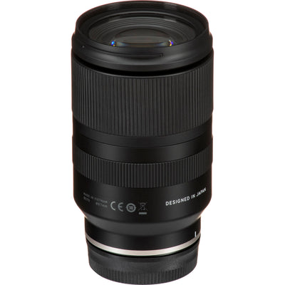 Camera lens with 'Designed in Japan' text on a white background