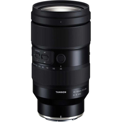 Black camera lens with Tamron branding on a white background