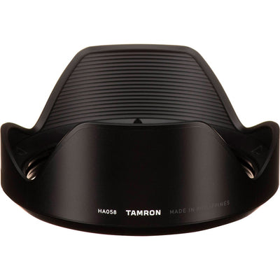 Black camera lens hood with Tamron branding on a white background
