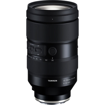 Black camera lens with Tamron branding on a white background