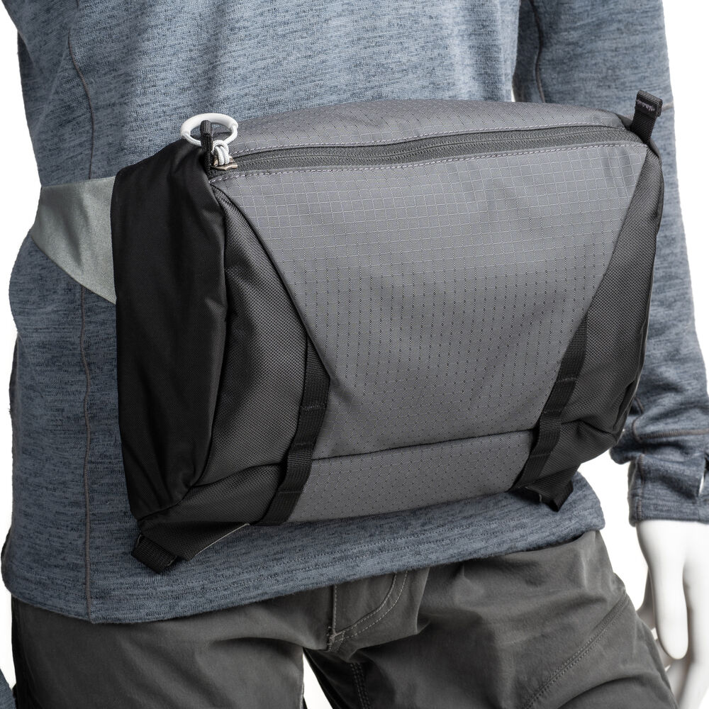 Versatile backpack with expandable pockets for outdoor photographers.