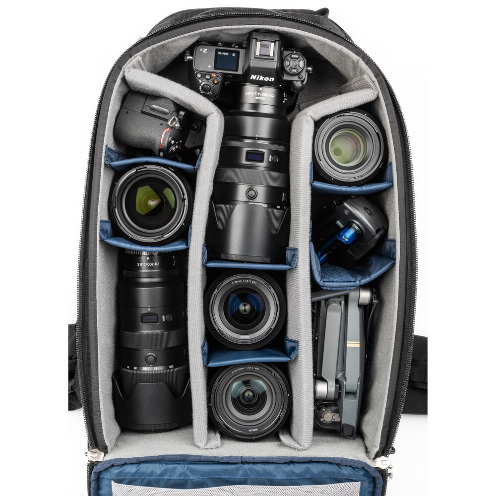 Versatile backpack with expandable pockets for outdoor photographers.