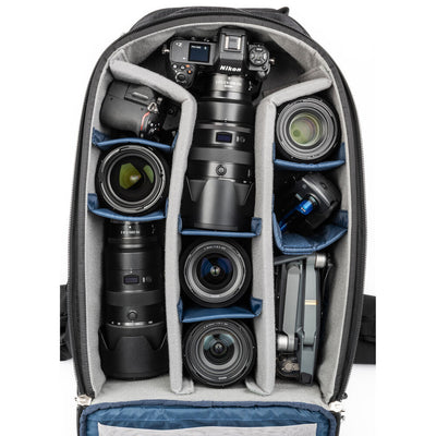 Versatile backpack with expandable pockets for outdoor photographers.