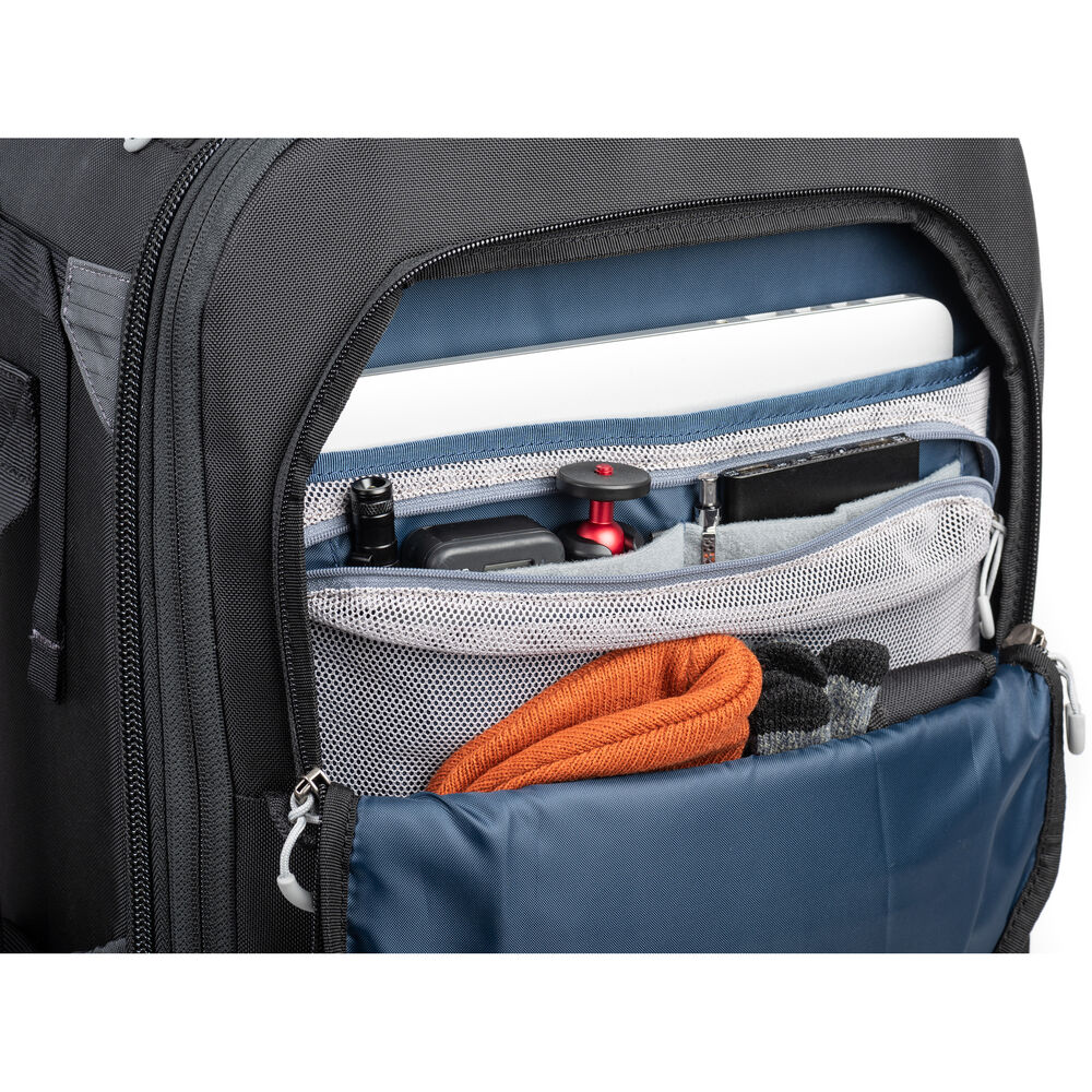 FirstLight 46L+ camera backpack with expandable front pocket.