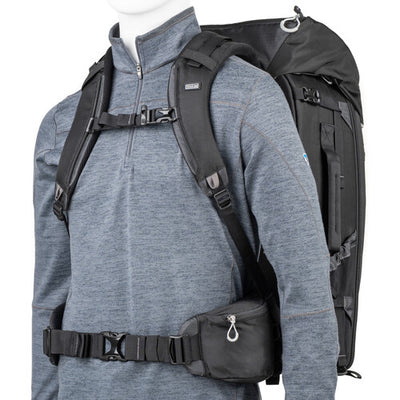 FirstLight 46L+ camera backpack with expandable front pocket.