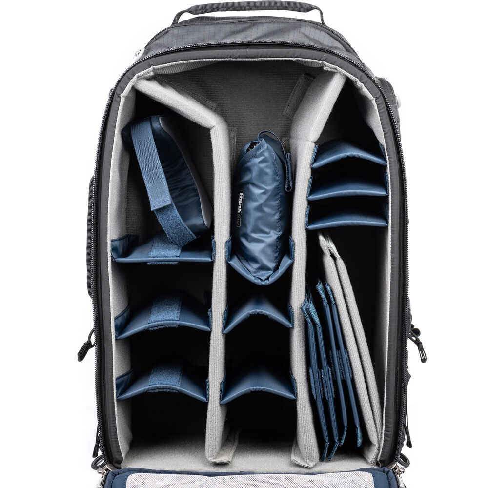 FirstLight 46L+ camera backpack with expandable front pocket.