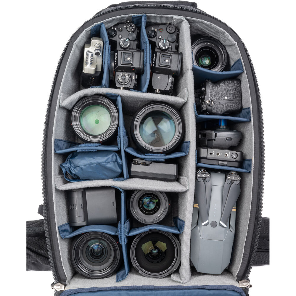 FirstLight 46L+ camera backpack with expandable front pocket.