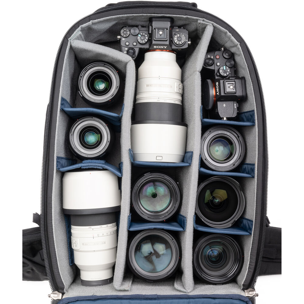 FirstLight 46L+ camera backpack with expandable front pocket.