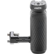 Tilta Xeno Side Handle with dual 1/4"-20 screw mount in black, featuring an ergonomic non-slip silicone grip and a cold shoe receiver for camera cage mounting.