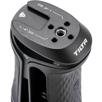 Tilta Xeno Side Handle with dual 1/4"-20 screw mount in black, featuring an ergonomic non-slip silicone grip and a cold shoe receiver for camera cage mounting.