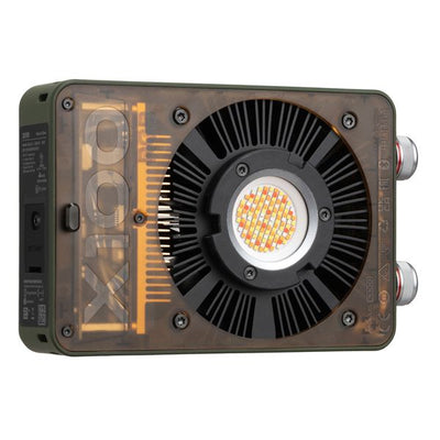 Zhiyun X100 RGB compact handheld video light with mini lens reflector and magnetic barn doors for even, vibrant lighting.
