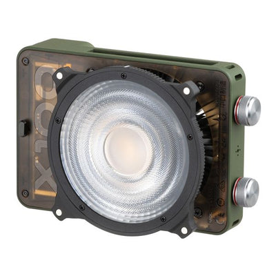 Zhiyun X100 RGB compact handheld video light with mini lens reflector and magnetic barn doors for even, vibrant lighting.